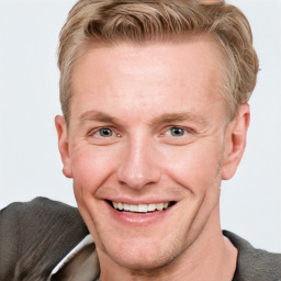 Joyful white adult male with short  brown hair and grey eyes