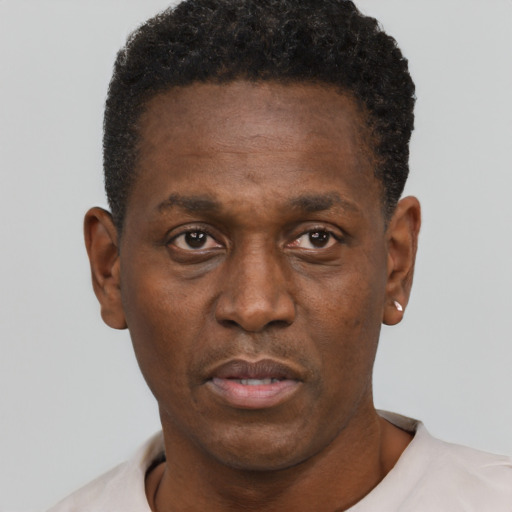 Neutral black adult male with short  black hair and brown eyes