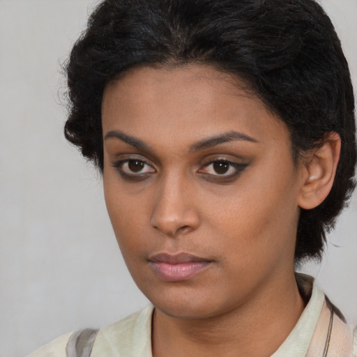 Neutral latino young-adult female with short  brown hair and brown eyes