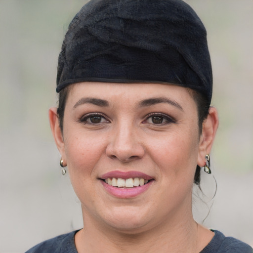 Joyful white young-adult female with short  black hair and brown eyes