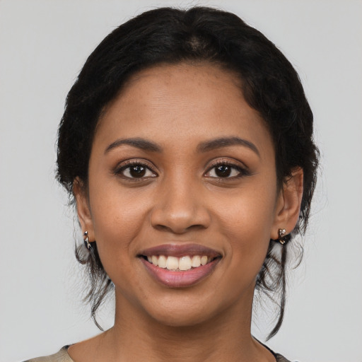 Joyful latino young-adult female with medium  black hair and brown eyes