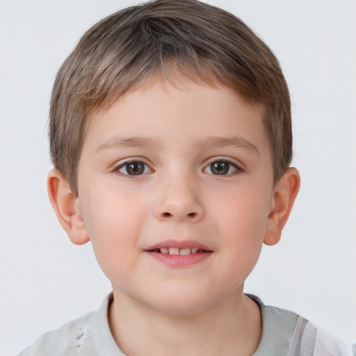 Joyful white child male with short  brown hair and brown eyes