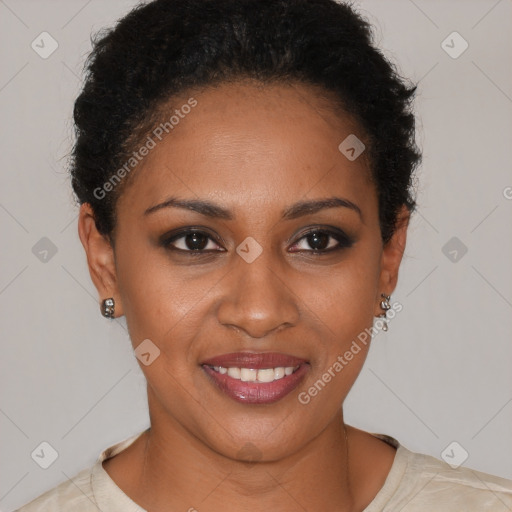 Joyful black young-adult female with short  brown hair and brown eyes