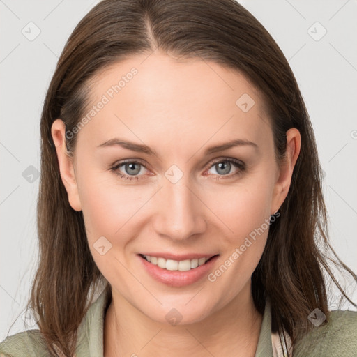 Joyful white young-adult female with medium  brown hair and grey eyes