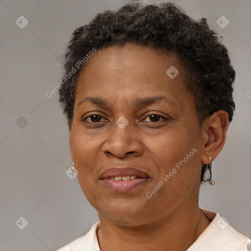 Joyful black adult female with short  brown hair and brown eyes