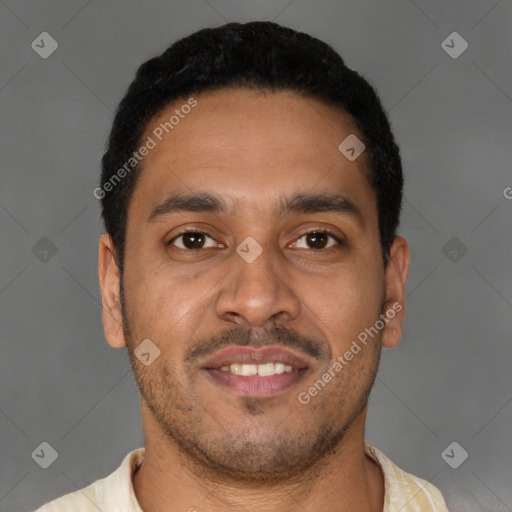 Joyful latino young-adult male with short  brown hair and brown eyes