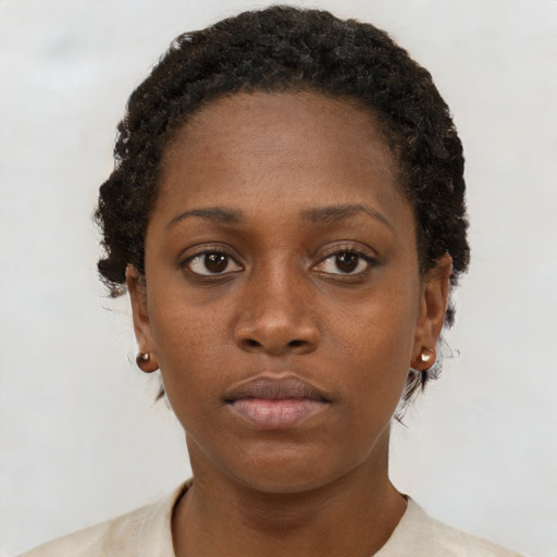 Neutral black young-adult female with short  brown hair and brown eyes