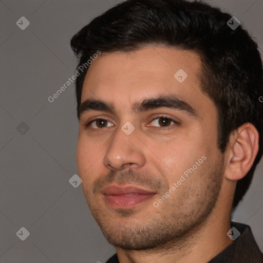 Joyful white young-adult male with short  black hair and brown eyes