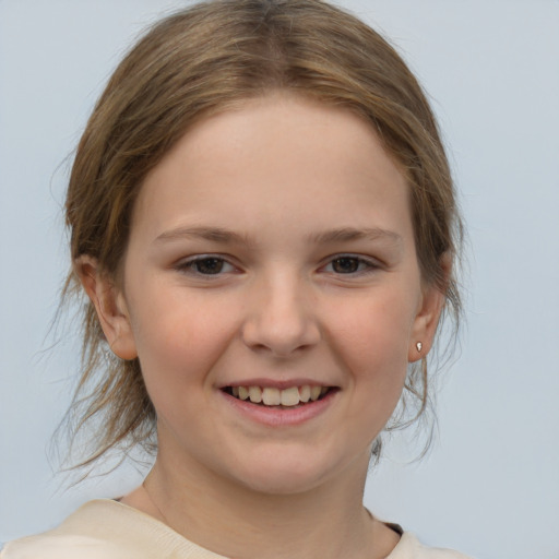 Joyful white child female with medium  brown hair and brown eyes