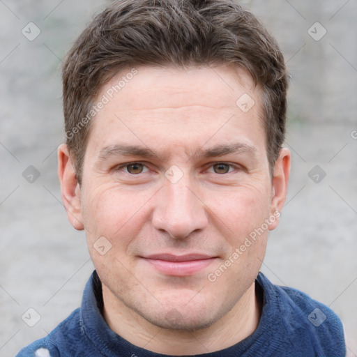 Joyful white adult male with short  brown hair and grey eyes