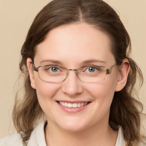 Joyful white young-adult female with medium  brown hair and grey eyes