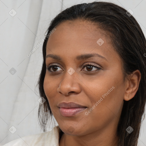 Joyful black young-adult female with long  brown hair and brown eyes