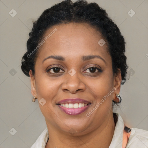 Joyful latino adult female with short  brown hair and brown eyes