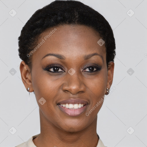 Joyful black young-adult female with short  brown hair and brown eyes