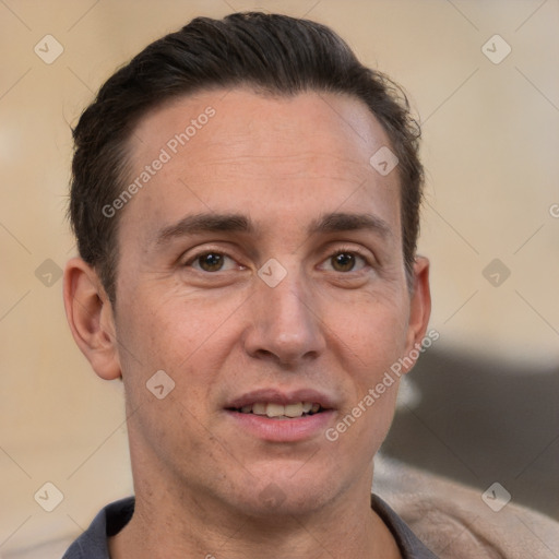 Joyful white adult male with short  brown hair and brown eyes