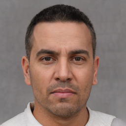 Neutral white adult male with short  brown hair and brown eyes