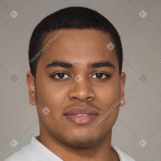 Joyful black young-adult male with short  brown hair and brown eyes