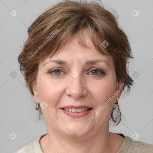 Joyful white adult female with medium  brown hair and grey eyes