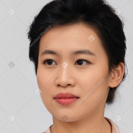 Joyful asian young-adult female with medium  black hair and brown eyes