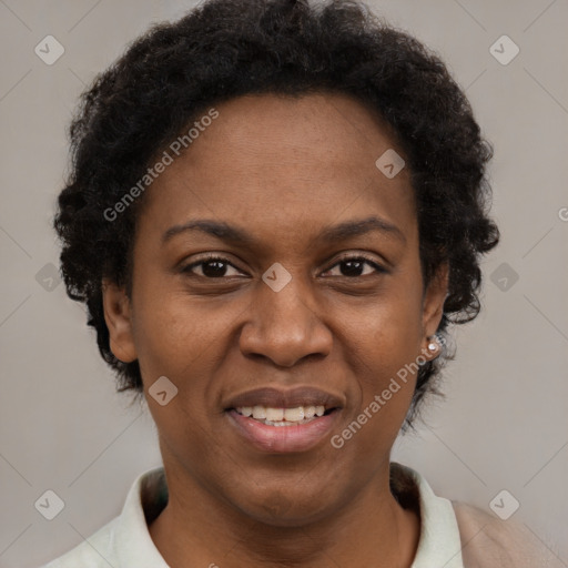 Joyful black adult female with short  brown hair and brown eyes