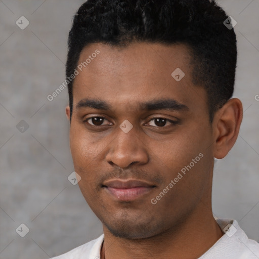 Joyful black young-adult male with short  black hair and brown eyes