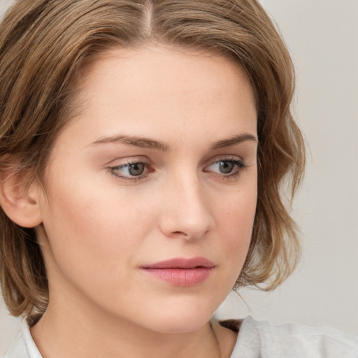 Neutral white young-adult female with medium  brown hair and blue eyes