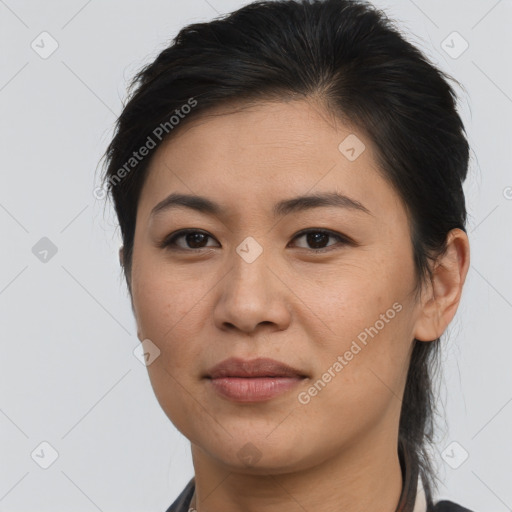 Joyful asian young-adult female with medium  brown hair and brown eyes