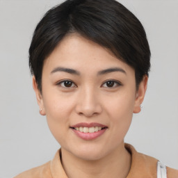 Joyful asian young-adult female with short  brown hair and brown eyes