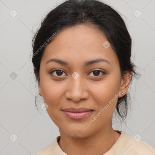 Joyful latino young-adult female with medium  brown hair and brown eyes