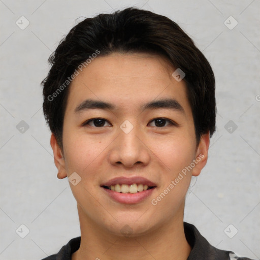 Joyful asian young-adult male with short  black hair and brown eyes