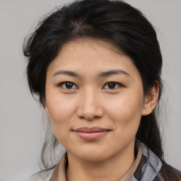 Joyful asian young-adult female with medium  brown hair and brown eyes