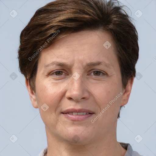 Joyful white adult female with short  brown hair and brown eyes