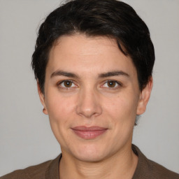 Joyful white adult female with short  brown hair and brown eyes