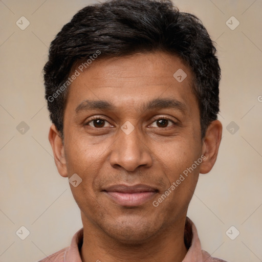 Joyful latino adult male with short  black hair and brown eyes