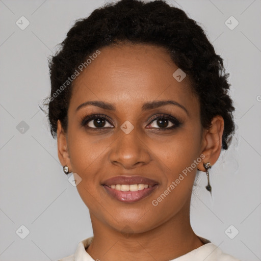 Joyful black young-adult female with short  brown hair and brown eyes