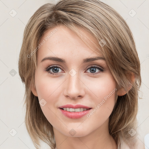 Joyful white young-adult female with medium  brown hair and blue eyes