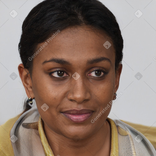 Joyful black young-adult female with short  brown hair and brown eyes