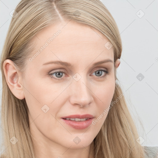 Joyful white young-adult female with long  brown hair and blue eyes