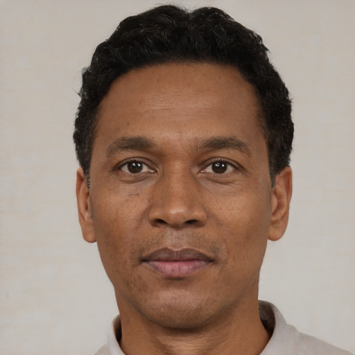 Neutral black adult male with short  black hair and brown eyes