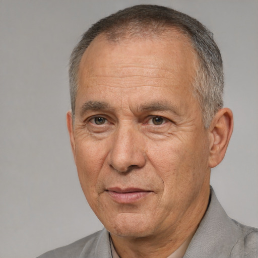 Joyful white middle-aged male with short  gray hair and brown eyes