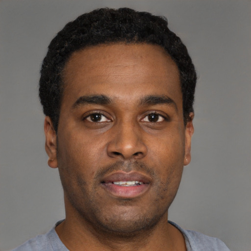 Neutral black young-adult male with short  brown hair and brown eyes