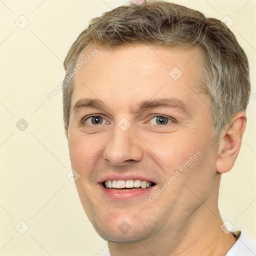 Joyful white adult male with short  brown hair and brown eyes