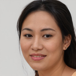 Joyful asian young-adult female with long  brown hair and brown eyes