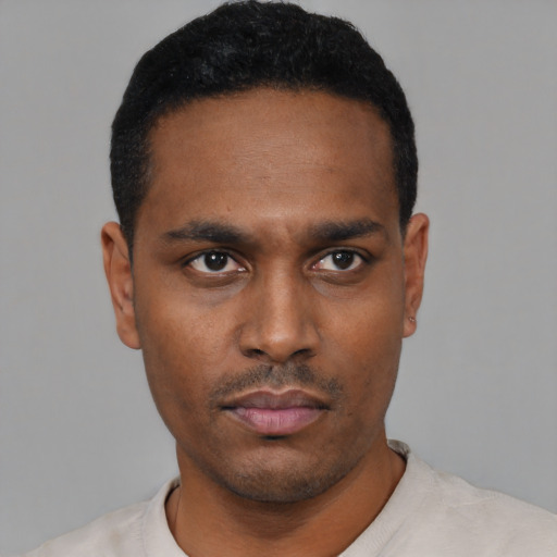 Neutral black young-adult male with short  black hair and brown eyes