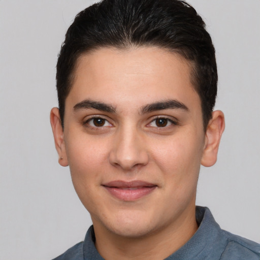 Joyful white young-adult male with short  brown hair and brown eyes