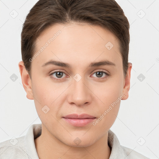 Joyful white young-adult female with short  brown hair and grey eyes