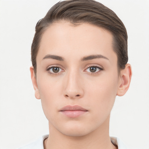 Neutral white young-adult female with short  brown hair and brown eyes