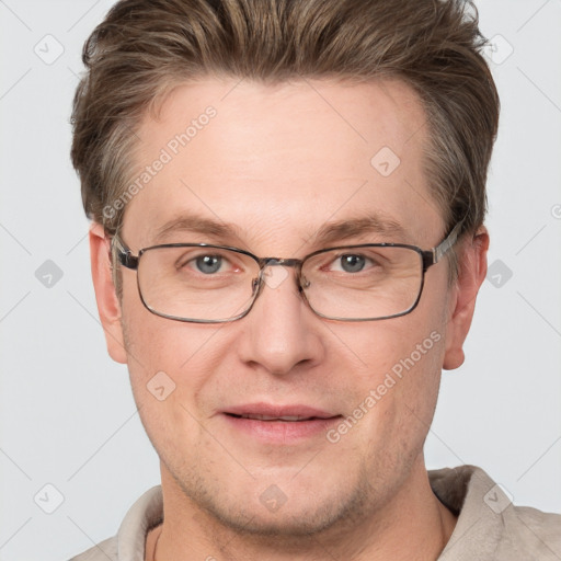 Joyful white adult male with short  brown hair and grey eyes