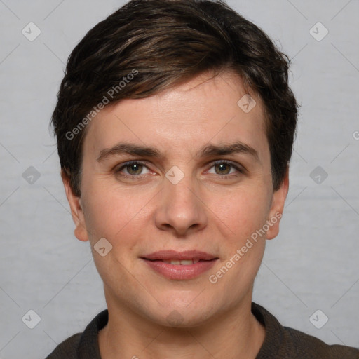 Joyful white young-adult female with short  brown hair and grey eyes