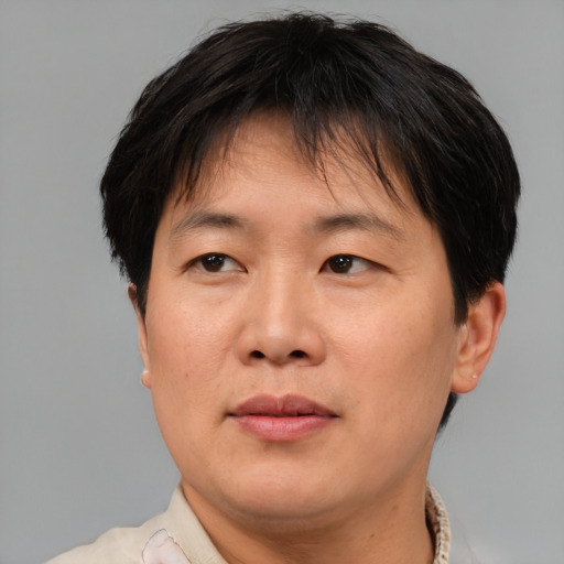 Neutral asian adult female with short  brown hair and brown eyes